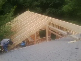 Framing a new roof addition that ties into an existing shingle roof in South Pekin